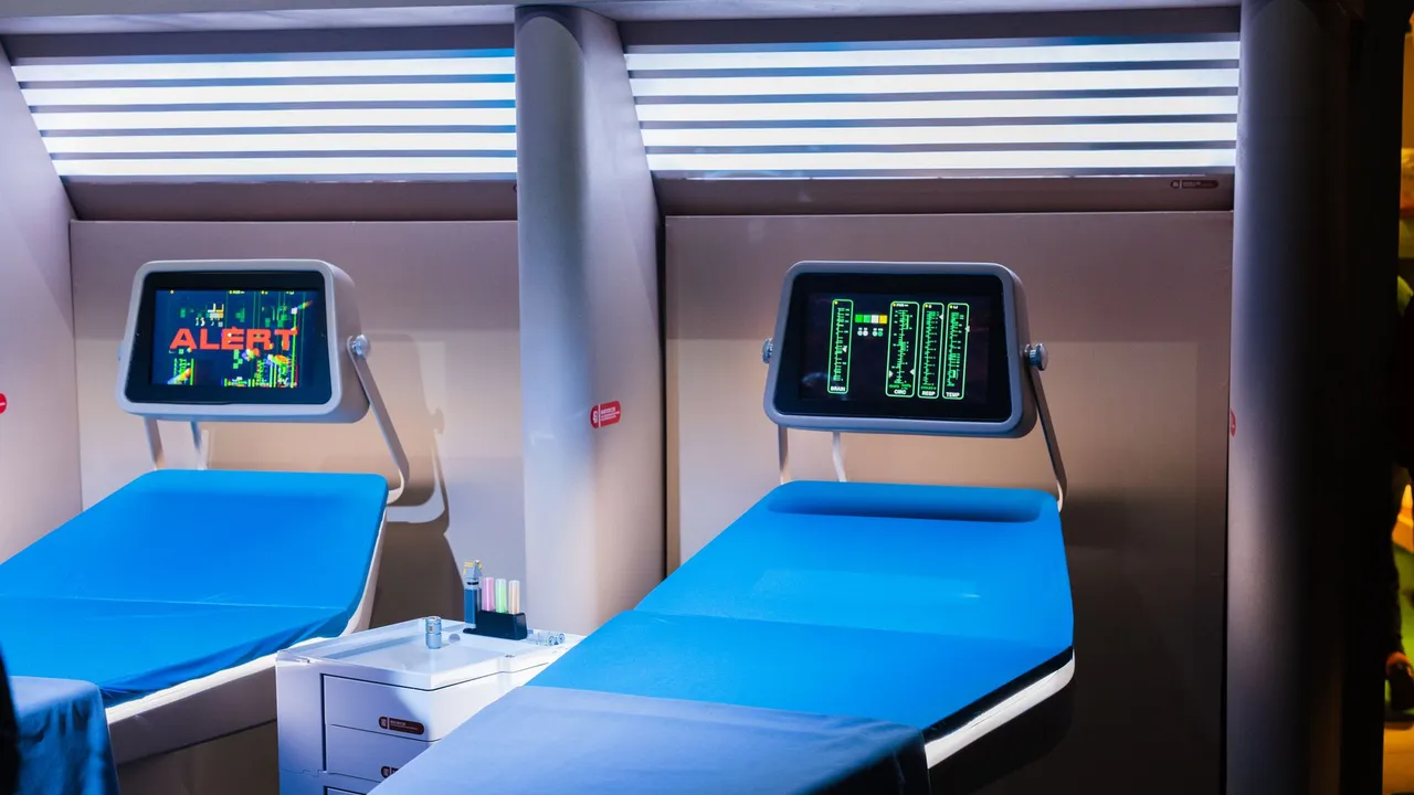 A modern hospital room featuring advanced medical equipment with digital displays.