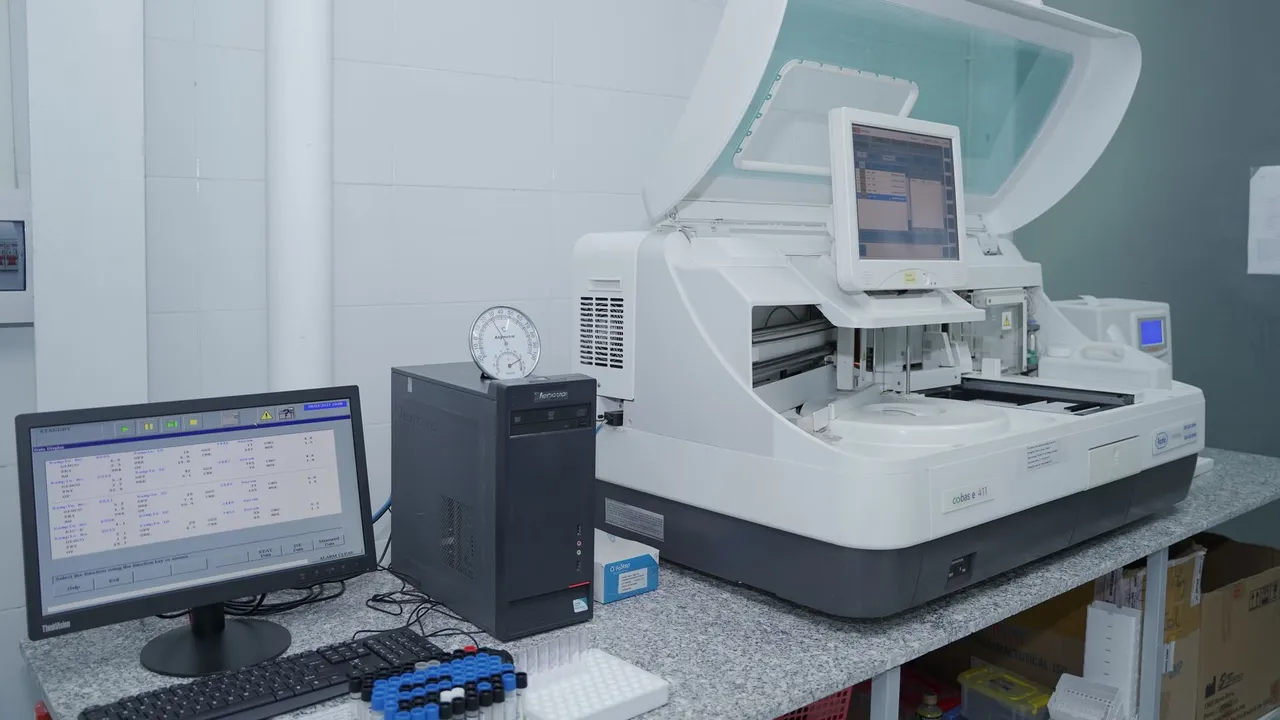 High-tech laboratory equipment with computer system in lab setting.