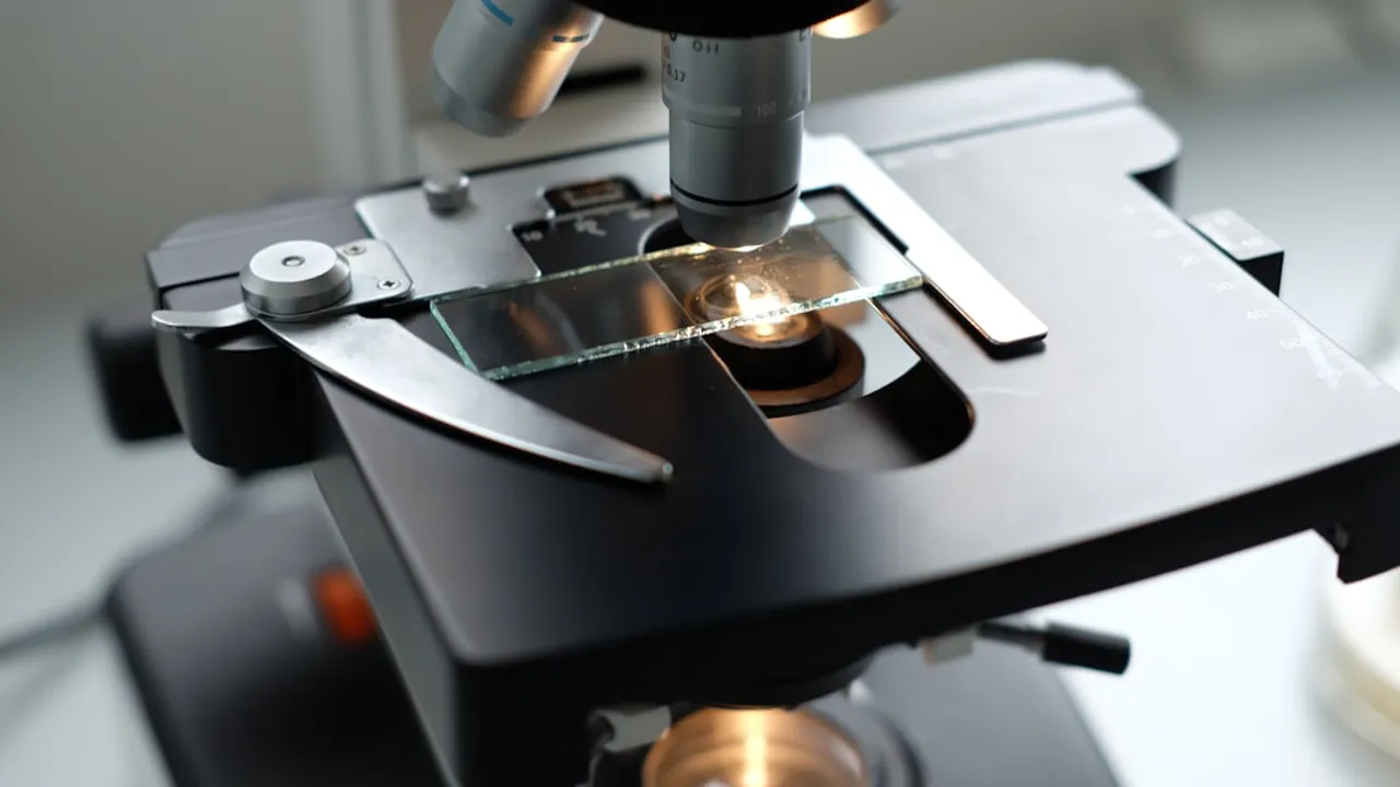A microscope being used to examine a substance