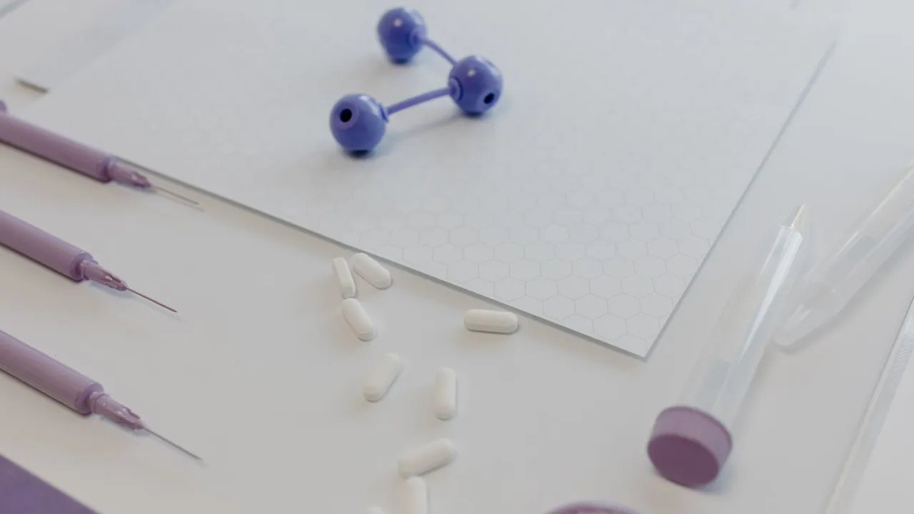 Medical tools and pills arranged on a table, showcasing a laboratory research setting.