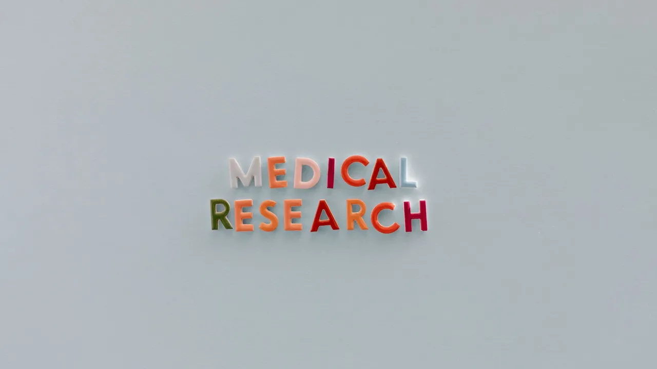 Minimalistic text 'Medical Research' in colorful letters on a neutral background.