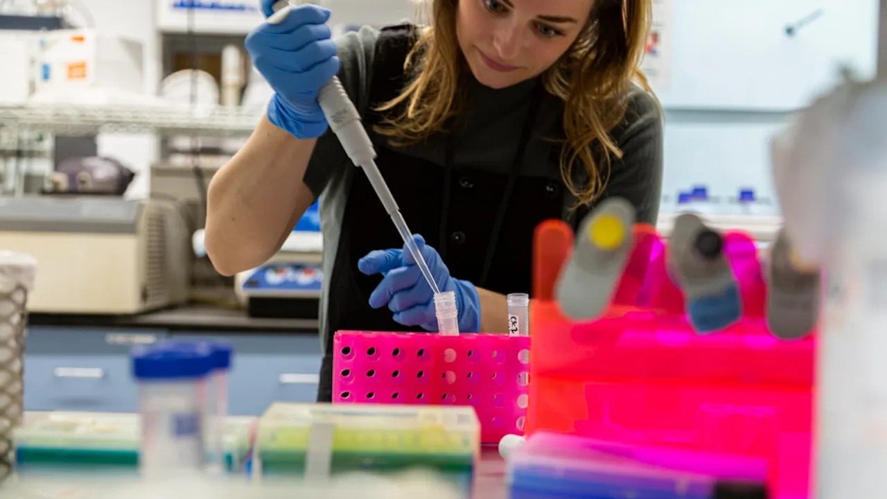 Scientist uses pipette in a laboratory.