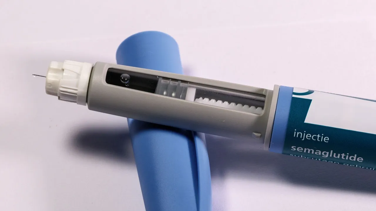 Detailed view of a semaglutide injection pen, commonly used for diabetes treatment, on a plain background.