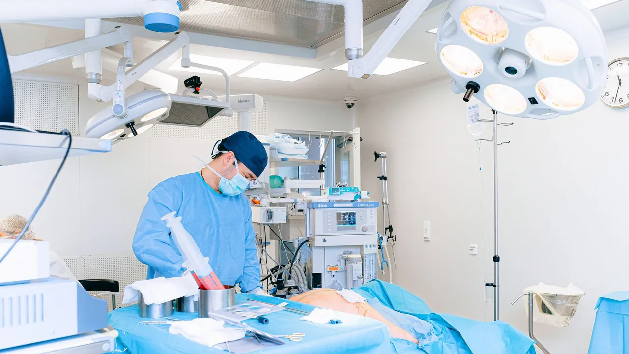 Experienced surgeon performing a procedure in a well-equipped operating room.