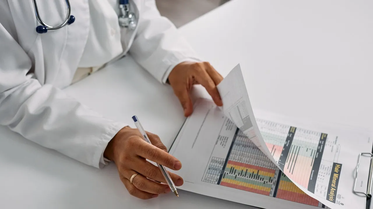 A medical professional checking patient reports with a clipboard in an office setting.