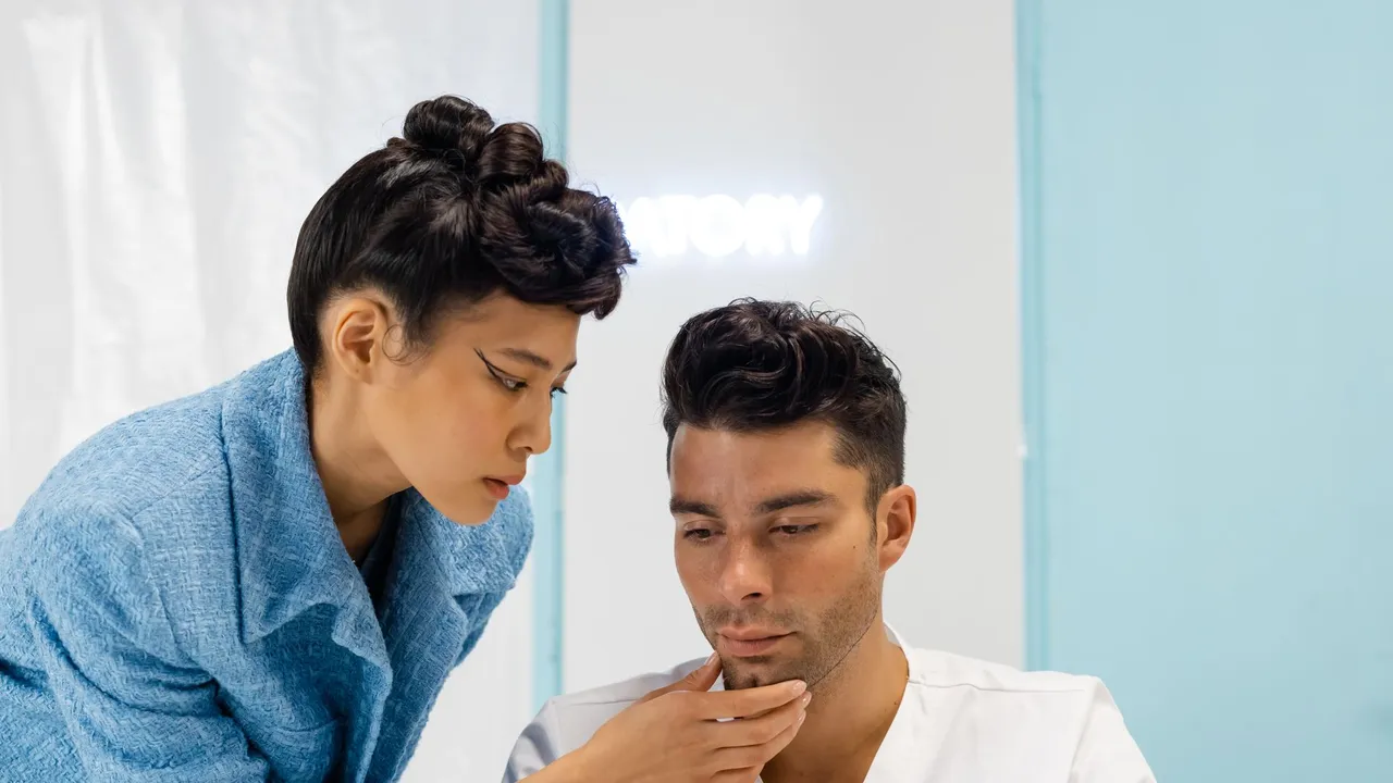 A female doctor consulting a patient in a modern medical office setting.