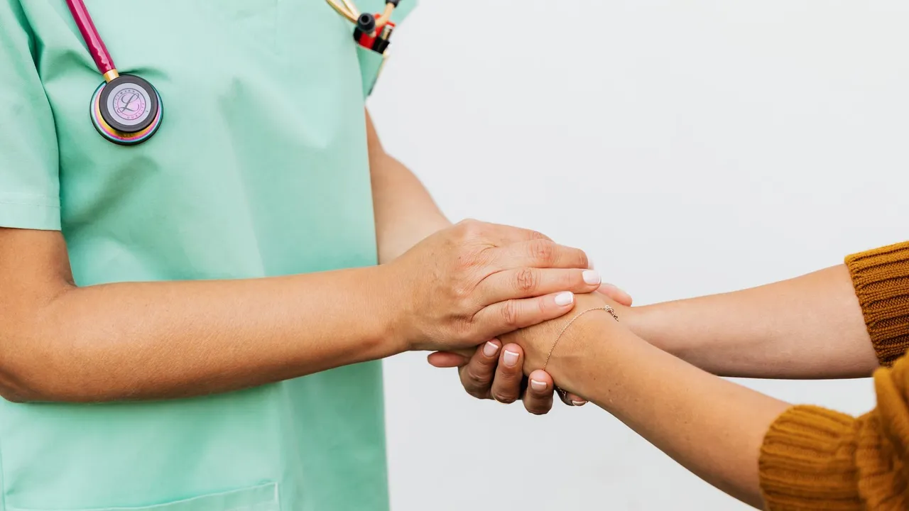 Healthcare professional reviews medical form during patient consultation in a clinic setting.